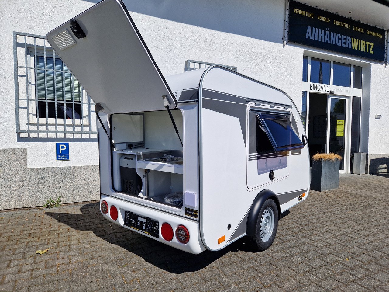 Caravan Mini Camper Mini Tommy TMC25 252x140x121cm aero V1 Küche 12V/230V 100km/H 750kg gebremst Modell 24