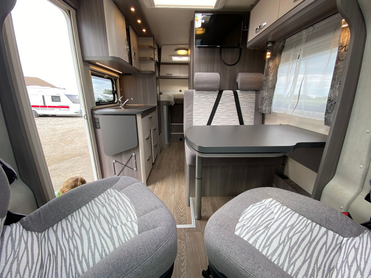Half integraal camper Hobby Optima Ontour Edition V65 GE Navi Markise SAT