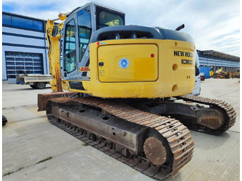 Rupsgraafmachine NEW HOLLAND