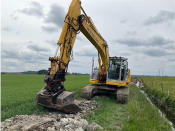 Rupsgraafmachine NEW HOLLAND