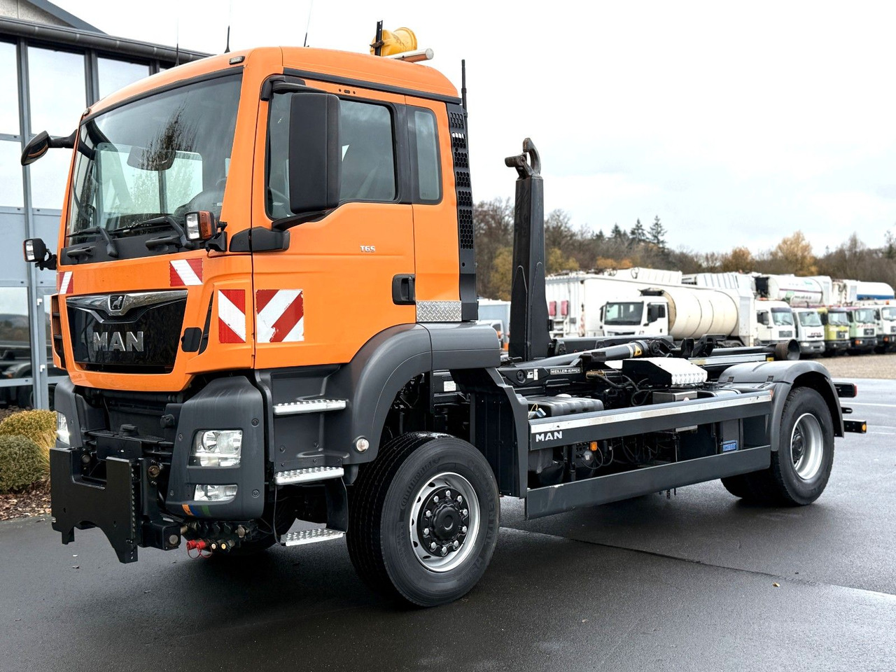 MAN TGS 18.360 4x4 Winterdienst Meiller Abroller - Haakarmsysteem vrachtwagen: afbeelding 1 MAN TGS 18.360 4x4 Winterdienst Meiller Abroller - Haakarmsysteem vrachtwagen: afbeelding 1