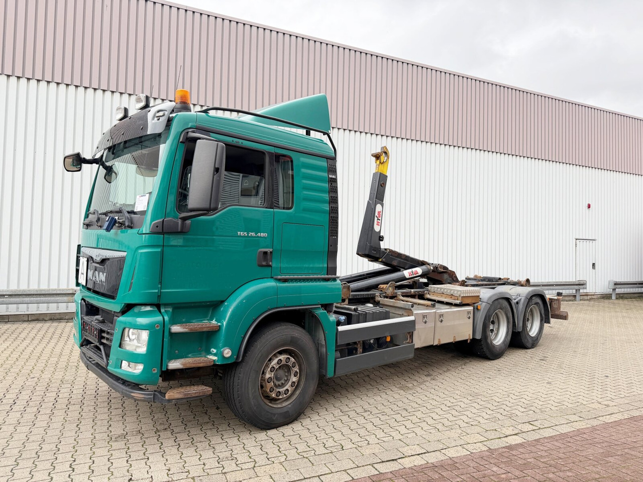 MAN TGS 26.480 6x4 BL TGS 26.480 6x4 BL, Motorabtrieb, Navi, Intarder, Hyva 20.60 S - Haakarmsysteem vrachtwagen: afbeelding 1 MAN TGS 26.480 6x4 BL TGS 26.480 6x4 BL, Motorabtrieb, Navi, Intarder, Hyva 20.60 S - Haakarmsysteem vrachtwagen: afbeelding 1