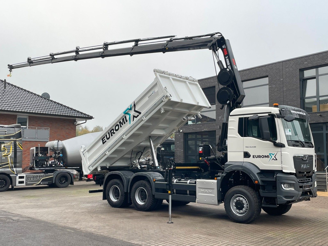 MAN TGS 33.440 6x6 /3-Seiten- Kipper / HIAB 228-6 - Kipper vrachtwagen, Kraanwagen: afbeelding 1 MAN TGS 33.440 6x6 /3-Seiten- Kipper / HIAB 228-6 - Kipper vrachtwagen, Kraanwagen: afbeelding 1