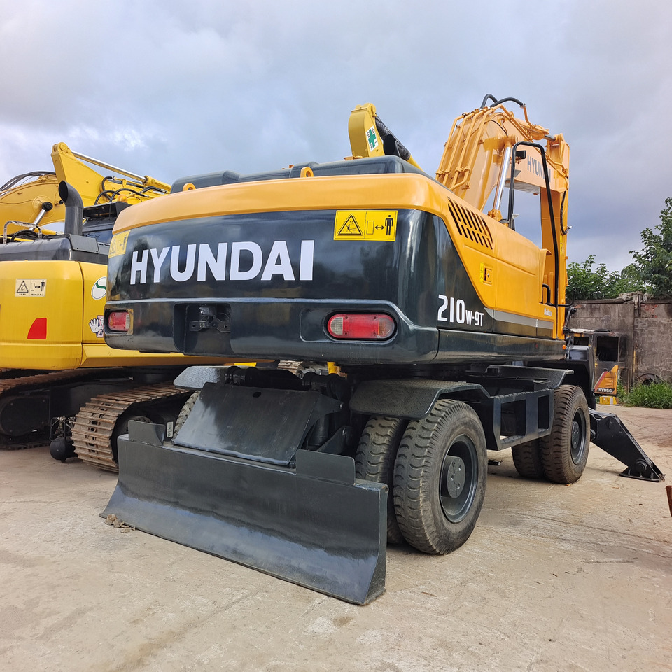 HYUNDAI 210W-9T - Mobiele graafmachine: afbeelding 1 HYUNDAI 210W-9T - Mobiele graafmachine: afbeelding 1