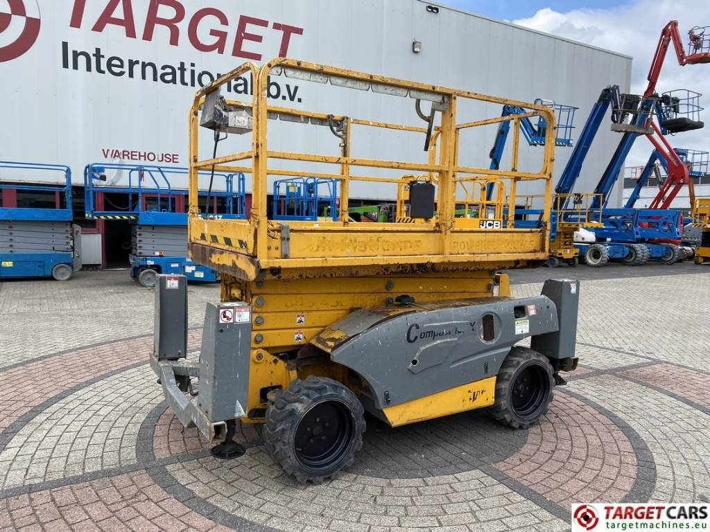 Haulotte Compact 12DX Diesel 4x4 Scissor Work Lift 1206cm - Schaarlift: afbeelding 1 Haulotte Compact 12DX Diesel 4x4 Scissor Work Lift 1206cm - Schaarlift: afbeelding 1