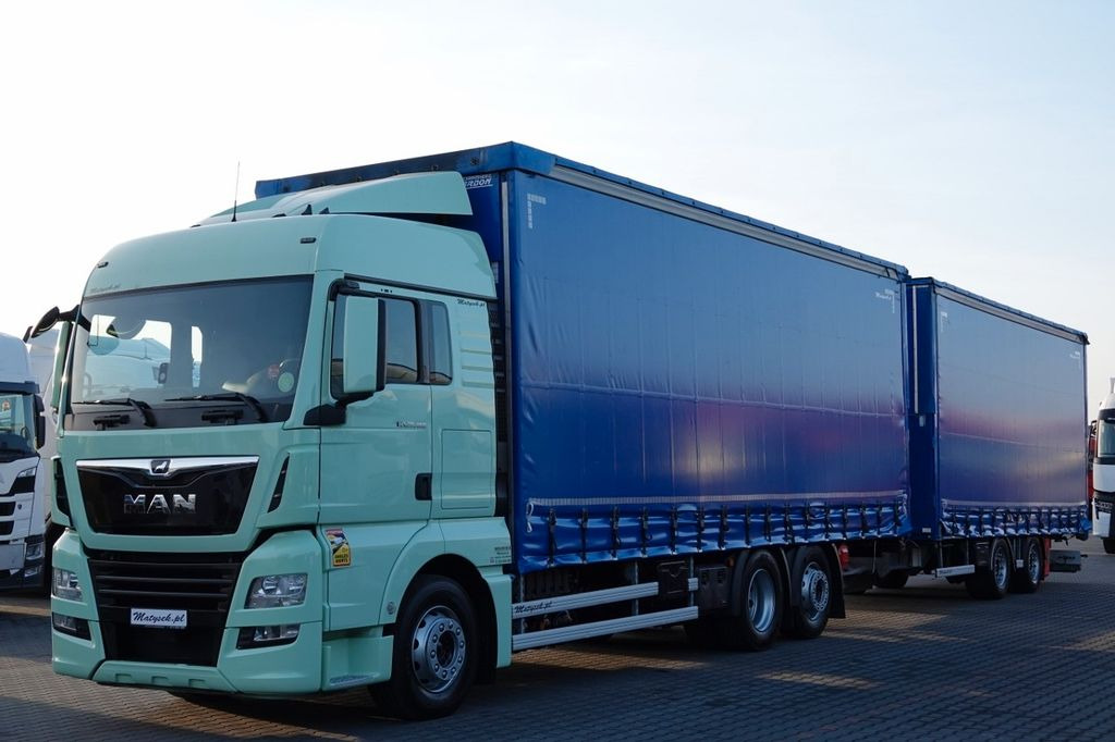 MAN TGX 26.460 / ZESTAW TANDEM PRZEJAZDOWY / 120 M3 - Schuifzeilen vrachtwagen: afbeelding 1 MAN TGX 26.460 / ZESTAW TANDEM PRZEJAZDOWY / 120 M3 - Schuifzeilen vrachtwagen: afbeelding 1
