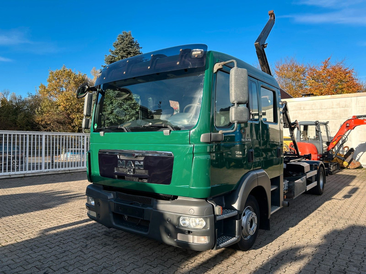 MAN 12.250 Doppelkabine Abroller - Haakarmsysteem vrachtwagen: afbeelding 1 MAN 12.250 Doppelkabine Abroller - Haakarmsysteem vrachtwagen: afbeelding 1