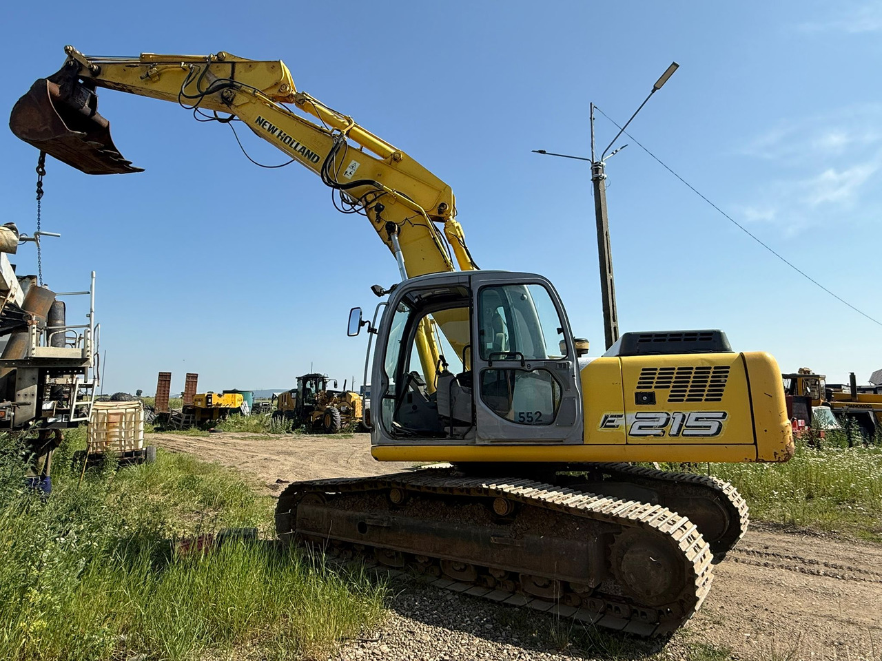 NEW HOLLAND E 215 EXCAVATOR - Rupsgraafmachine: afbeelding 2 NEW HOLLAND E 215 EXCAVATOR - Rupsgraafmachine: afbeelding 2