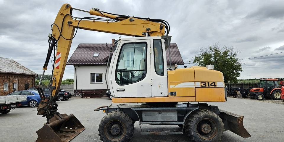 Koparka kołowa Liebherr A314 Litronic 9350 h+ 5 łyżek kołówka - Mobiele graafmachine: afbeelding 1 Koparka kołowa Liebherr A314 Litronic 9350 h+ 5 łyżek kołówka - Mobiele graafmachine: afbeelding 1