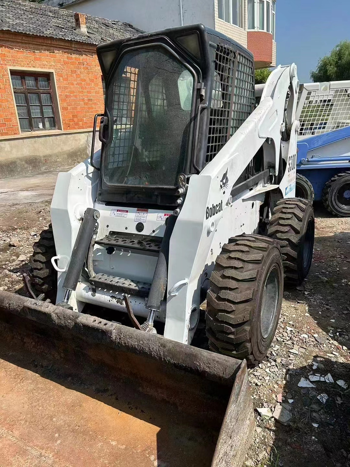High Quality Mini Construction Machine Used Bobcat Skid Steer Loader S300 in Stock for Sale Bobcat Loader With Low Price - Schranklader: afbeelding 1 High Quality Mini Construction Machine Used Bobcat Skid Steer Loader S300 in Stock for Sale Bobcat Loader With Low Price - Schranklader: afbeelding 1