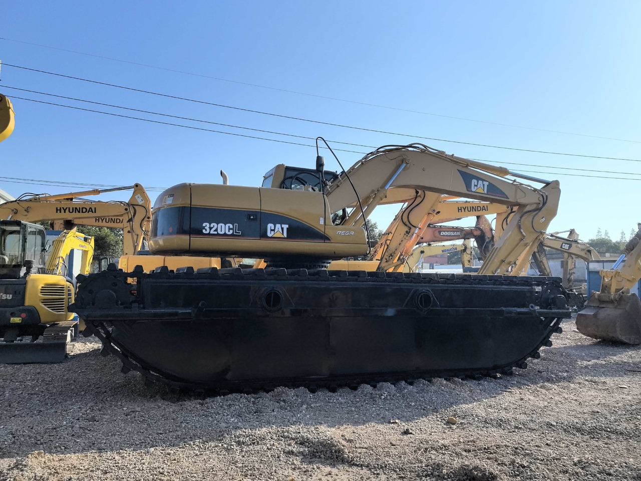 CATERPILLAR 320C - Amfibische graafmachine: afbeelding 1 CATERPILLAR 320C - Amfibische graafmachine: afbeelding 1