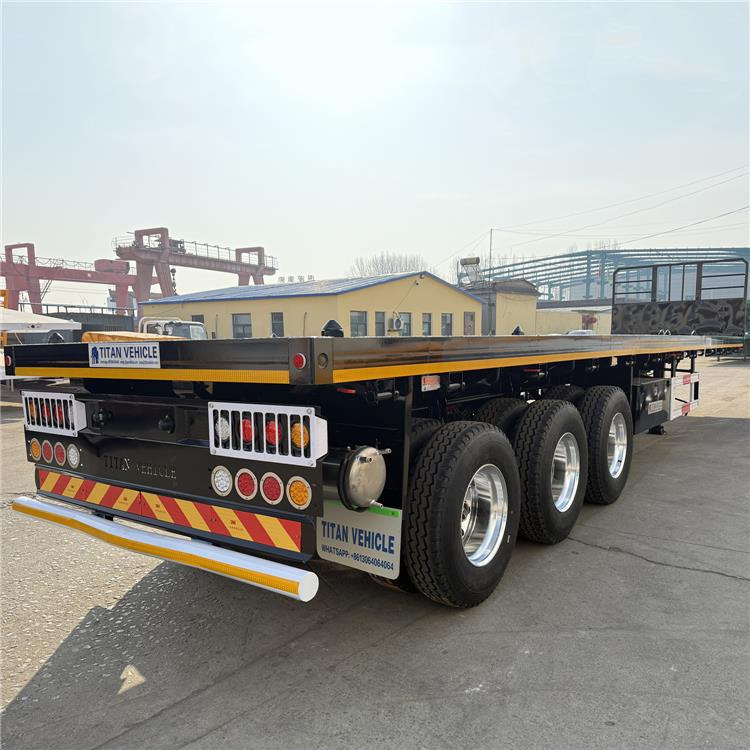TITAN 12.5M 3 Axle Flat Deck Trailer for Sale In Tanzania - Containertransporter/ Wissellaadbak oplegger: afbeelding 1 TITAN 12.5M 3 Axle Flat Deck Trailer for Sale In Tanzania - Containertransporter/ Wissellaadbak oplegger: afbeelding 1