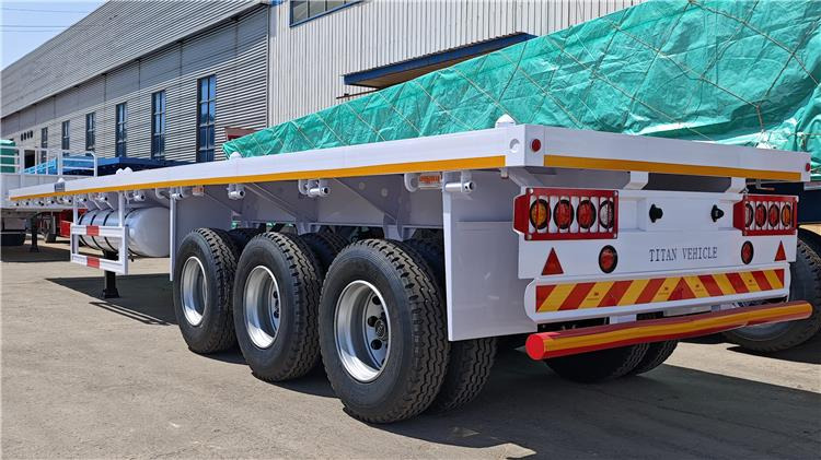 TITAN 40ft Tri Axle Flatbed Semi Trailer for Sale Price In Nigeria Lagos - Containertransporter/ Wissellaadbak oplegger: afbeelding 3 TITAN 40ft Tri Axle Flatbed Semi Trailer for Sale Price In Nigeria Lagos - Containertransporter/ Wissellaadbak oplegger: afbeelding 3