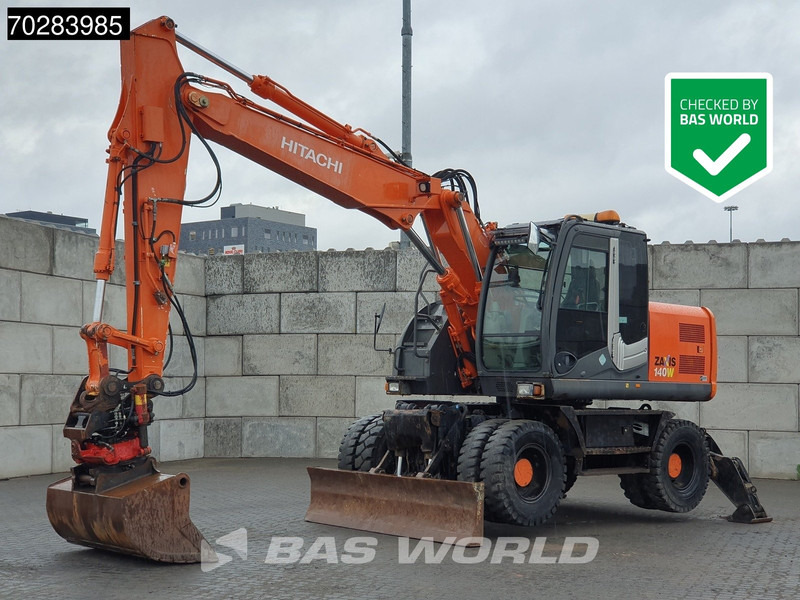 Hitachi ZX140W -3 OUTRIGGERS - ROTOTILT - Mobiele graafmachine: afbeelding 1 Hitachi ZX140W -3 OUTRIGGERS - ROTOTILT - Mobiele graafmachine: afbeelding 1