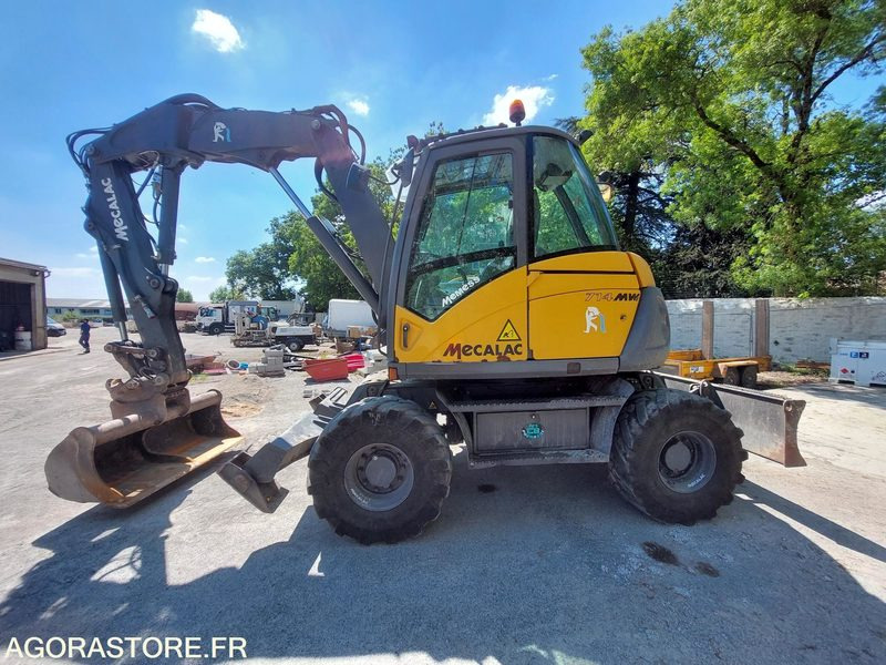 PELLE SUR PNEUS MECALAC 714MW - 2015 / 11 459 HEURES - Graafmachine: afbeelding 1 PELLE SUR PNEUS MECALAC 714MW - 2015 / 11 459 HEURES - Graafmachine: afbeelding 1