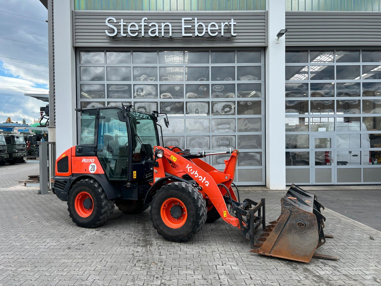 Kubota R070 / Gabel & Schaufel / nur 1.869h! - Wiellader: afbeelding 1 Kubota R070 / Gabel & Schaufel / nur 1.869h! - Wiellader: afbeelding 1